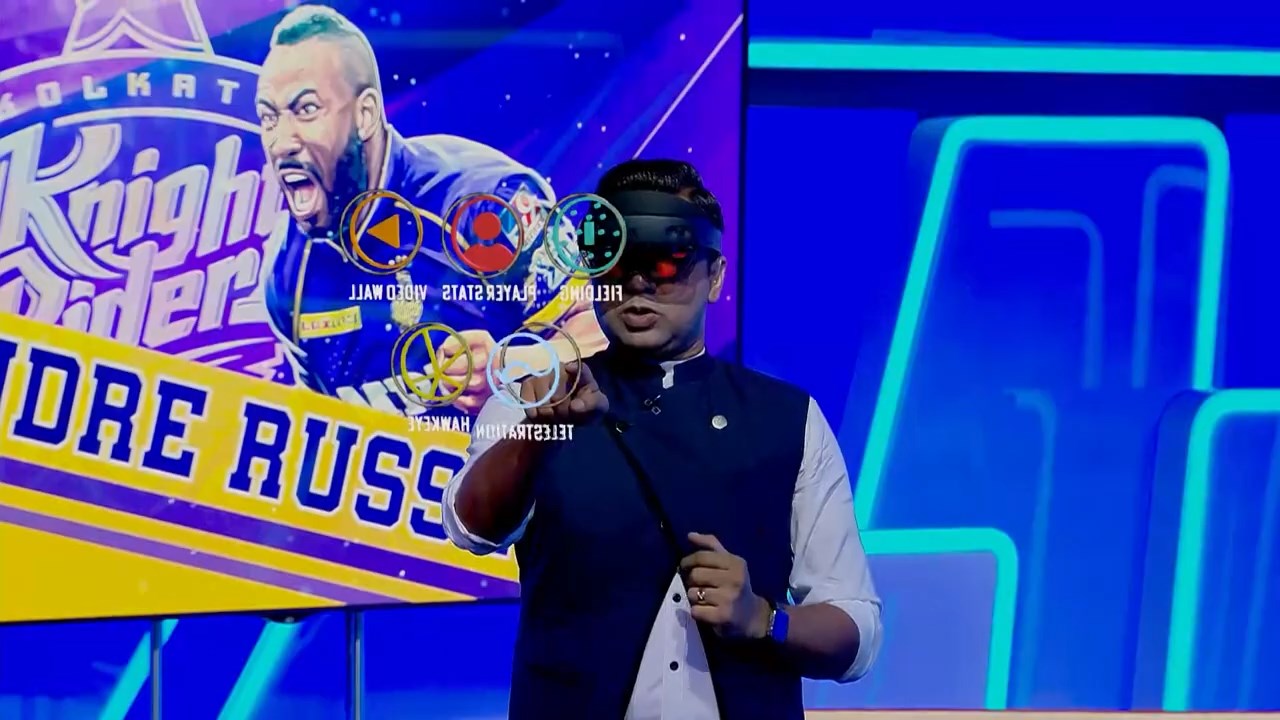 The presenter interacts with the graphics directly, through the HoloLens